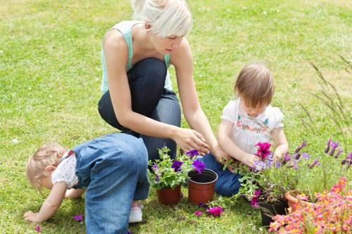 Gardening team discussing a landscaping plan in an urban courtyard