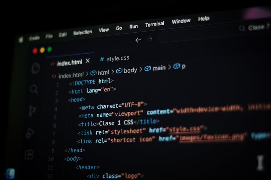 A close-up view of a computer screen displaying a code editor with HTML and CSS code. The code includes tags such as <html>, <head>, <title>, and <link>, with syntax highlighting in various colors lik